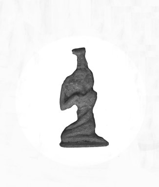  <em>Inlay in the Form of Nephthys Kneeling</em>, 343-30 B.C.E. Glass, 1 5/16 x 11/16 x 3/16 in. (3.4 x 1.7 x 0.4 cm). Brooklyn Museum, Charles Edwin Wilbour Fund, 37.1129E. Creative Commons-BY (Photo: Brooklyn Museum, CUR.37.1129E_37.1127E_GRPA_cropped.jpg)