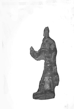  <em>Inlay in the Form of a Figure of the God Shu Standing</em>, 525-30 B.C.E. Glass, 1 13/16 x 5/8 x 3/16 in. (4.6 x 1.6 x 0.4 cm). Brooklyn Museum, Charles Edwin Wilbour Fund, 37.1130E. Creative Commons-BY (Photo: Brooklyn Museum, CUR.37.1130E_37.1127E_GRPA_cropped.jpg)