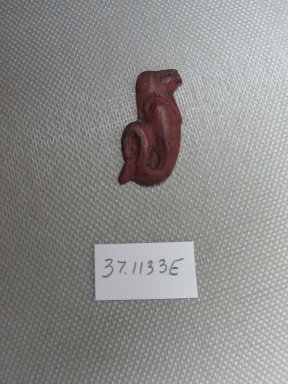  <em>Inlay in the Form of a Figure of a Falcon - Headed Uraeus</em>, 525-30 B.C.E. Glass, 1 1/8 x 5/8 x 1/16 in. (2.9 x 1.6 x 0.2 cm). Brooklyn Museum, Charles Edwin Wilbour Fund, 37.1133E. Creative Commons-BY (Photo: Brooklyn Museum, CUR.37.1133E_view1.jpg)