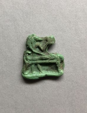  <em>Inlay or Amulet Representing Anubis</em>, 305-30 B.C.E. Glass, 1 × 1 × 3/16 in. (2.5 × 2.5 × 0.4 cm). Brooklyn Museum, Charles Edwin Wilbour Fund, 37.1146E. Creative Commons-BY (Photo: , CUR.37.1146E_view01.JPG)