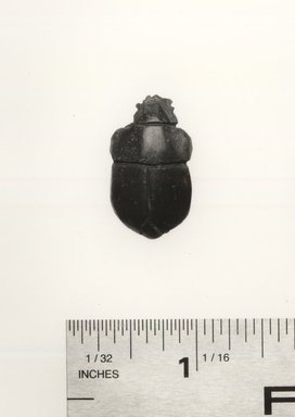  <em>Inlay in Form of a Scarab</em>, 525-30 B.C.E. Glass, 3/16 x 5/8 x 1 1/8 in. (0.5 x 1.6 x 2.8 cm). Brooklyn Museum, Charles Edwin Wilbour Fund, 37.1148E. Creative Commons-BY (Photo: Brooklyn Museum, CUR.37.1148E_35.1159_NegGRPA_cropped_print_bw.jpg)