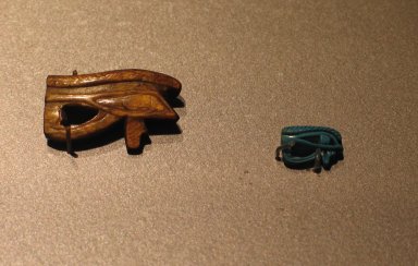  <em>Wadjet-eye Amulet</em>, ca. 1539-1075 B.C.E. Schist (probably), 7/8 x 1 7/16 x 1/4 in. (2.3 x 3.6 x 0.6 cm). Brooklyn Museum, Charles Edwin Wilbour Fund, 37.1287E. Creative Commons-BY (Photo: , CUR.37.1287E_37.1298E_erg456.jpg)