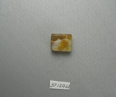  <em>Wadjet-eye Plaque</em>, 664–332 B.C.E. Chalcedony, 9/16 x 3/16 x 11/16 in. (1.5 x 0.5 x 1.7 cm). Brooklyn Museum, Charles Edwin Wilbour Fund, 37.1296E. Creative Commons-BY (Photo: Brooklyn Museum, CUR.37.1296E_view1.jpg)