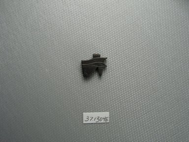  <em>Wadjet-eye Amulet</em>, 664–332 B.C.E. Limonite, 9/16 x 3/16 x 11/16 in. (1.5 x 0.4 x 1.8 cm). Brooklyn Museum, Charles Edwin Wilbour Fund, 37.1304E. Creative Commons-BY (Photo: Brooklyn Museum, CUR.37.1304E_view1.jpg)