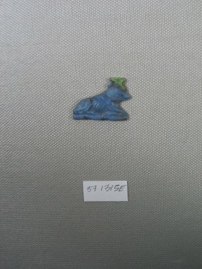  <em>Inlay in Form of Recumbent Cow</em>, 525-30 B.C.E. Glass, 1 1/8 x 3/16 x 7/8 in. (2.9 x 0.4 x 2.3 cm). Brooklyn Museum, Charles Edwin Wilbour Fund, 37.1315E. Creative Commons-BY (Photo: Brooklyn Museum, CUR.37.1315E_view1.jpg)