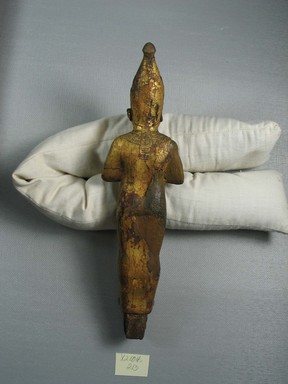  <em>Figure of Osiris</em>, 4th century B.C.E. or later. Wood, calcium ground, gold alloy leaf, copper alloy, polychromy, 8 15/16 x 2 1/2 x 1 7/8 in. (22.7 x 6.4 x 4.7 cm). Brooklyn Museum, Charles Edwin Wilbour Fund, 37.1375Ea-b. Creative Commons-BY (Photo: Brooklyn Museum, CUR.37.1375Ea-b_back.jpg)