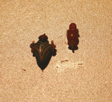  <em>Heart Amulet</em>, ca. 1539-1075 B.C.E. Glass, 11/16 x 9/16 x 1/4 in. (1.8 x 1.5 x 0.7 cm). Brooklyn Museum, Charles Edwin Wilbour Fund, 37.1441E. Creative Commons-BY (Photo: , CUR.37.1441E_37.1462E_erg456.jpg)