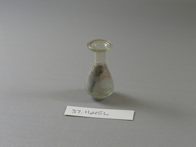  <em>Small Bottle</em>, 1st century C.E.-4th century C.E. Glass, 1 13/16 x diam. 15/16 in. (4.6 x 2.4 cm). Brooklyn Museum, Charles Edwin Wilbour Fund, 37.1645E. Creative Commons-BY (Photo: Brooklyn Museum, CUR.37.1645E_view1.jpg)