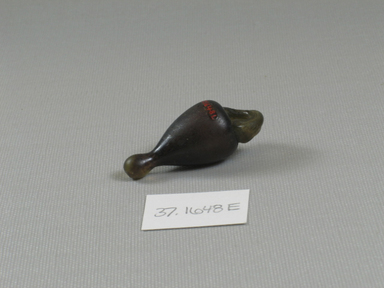  <em>Model or Amulet</em>, 30 B.C.E.–395 C.E. Glass, 1 15/16 x 13/16 x 13/16 in. (5 x 2 x 2.1 cm). Brooklyn Museum, Charles Edwin Wilbour Fund, 37.1648E. Creative Commons-BY (Photo: Brooklyn Museum, CUR.37.1648E_view1.jpg)