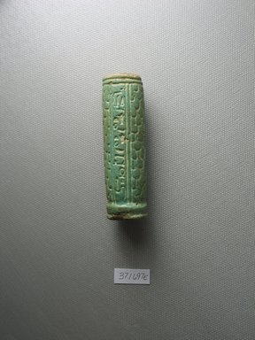 <em>Inscribed Handle</em>, 664-525 B.C.E. Faience, 3 7/16 x Diam. 1 in. (8.8 x 2.5 cm). Brooklyn Museum, Charles Edwin Wilbour Fund, 37.1697E. Creative Commons-BY (Photo: Brooklyn Museum, CUR.37.1697E_view1.jpg)