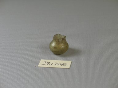  <em>Miniature Bottle Fragment</em>, ca. 1st-8th century C.E. Glass, 11/16 x greatest diam. 11/16 in. (1.7 x 1.8 cm). Brooklyn Museum, Charles Edwin Wilbour Fund, 37.1714E. Creative Commons-BY (Photo: Brooklyn Museum, CUR.37.1714E.jpg)