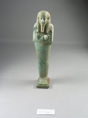  <em>Ushabti of Psamtik-men</em>, 664–332 B.C.E. Faience, 7 3/8 x 1 3/4 x 1 1/16 in. (18.7 x 4.5 x 2.7 cm). Brooklyn Museum, Charles Edwin Wilbour Fund, 37.172E. Creative Commons-BY (Photo: Brooklyn Museum, CUR.37.172E_front.jpg)