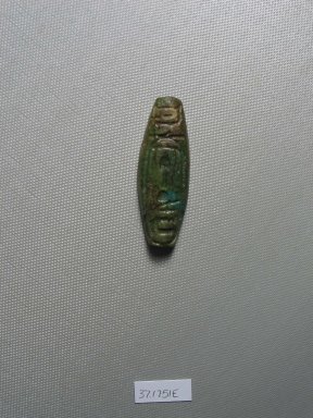 Egyptian. <em>Bead Inscribed for King Shabaka</em>. Faience, 3/8 x 13/16 x 2 5/16 in. (0.9 x 2.1 x 5.8 cm). Brooklyn Museum, Charles Edwin Wilbour Fund, 37.1751E. Creative Commons-BY (Photo: Brooklyn Museum, CUR.37.1751E_view1.jpg)