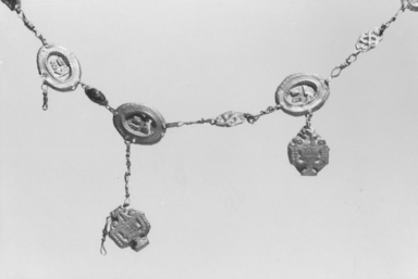  <em>Necklace</em>, 1833-1843 C.E. Gold, glass, Plaque: 1/2 x 11/16 in. (1.3 x 1.7 cm). Brooklyn Museum, Charles Edwin Wilbour Fund, 37.1774E. Creative Commons-BY (Photo: , CUR.37.1774E_NegID_L669_6_print_bw.jpg)