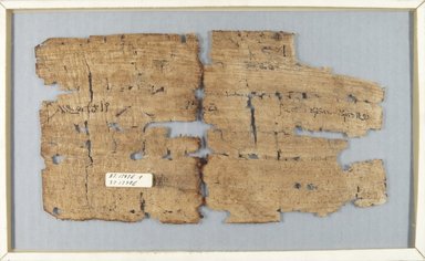  <em>Papyrus Fragments Inscribed in Demotic</em>, 1st-2nd century C.E. Papyrus, ink, Glass: 7 1/8 x 11 5/8 in. (18.1 x 29.5 cm). Brooklyn Museum, Charles Edwin Wilbour Fund, 37.1798E (Photo: , CUR.37.1797E_37.1798E_verso_IMLS_PS5.jpg)