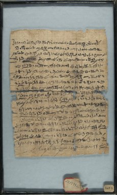  <em>Papyrus Inscribed in Abnormal Hieratic</em>, 664–525 B.C.E. Papyrus, ink, Glass: 8 11/16 x 14 3/16 in. (22 x 36 cm). Brooklyn Museum, Charles Edwin Wilbour Fund, 37.1799E (Photo: Brooklyn Museum, CUR.37.1799E_recto_IMLS_PS5.jpg)