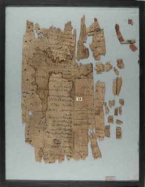  <em>Papyrus Inscribed in Demotic</em>, 4th-3rd century B.C.E. Papyrus, ink, Glass: 14 x 17 15/16 in. (35.5 x 45.6 cm). Brooklyn Museum, Charles Edwin Wilbour Fund, 37.2005E (Photo: Brooklyn Museum, CUR.37.2005E_IMLS_PS5.jpg)