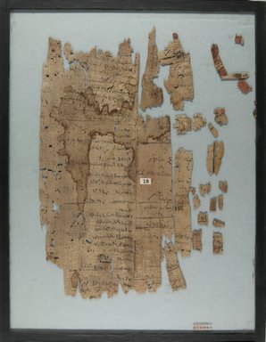  <em>Papyrus Inscribed in Demotic</em>, 4th–3rd century B.C.E. Papyrus, ink, Glass: 14 x 17 15/16 in. (35.5 x 45.6 cm). Brooklyn Museum, Charles Edwin Wilbour Fund, 37.2005E (Photo: Brooklyn Museum, CUR.37.2005E_IMLS_PS5.jpg)