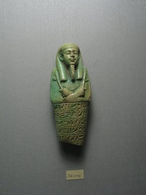  <em>Ushabti of the Chief Physician Psamtekseneb</em>, 664–525 B.C.E. Faience, 4 13/16 x 1 7/8 x 1 5/16 in. (12.3 x 4.8 x 3.3 cm). Brooklyn Museum, Charles Edwin Wilbour Fund, 37.204E. Creative Commons-BY (Photo: Brooklyn Museum, CUR.37.204E_view1.jpg)