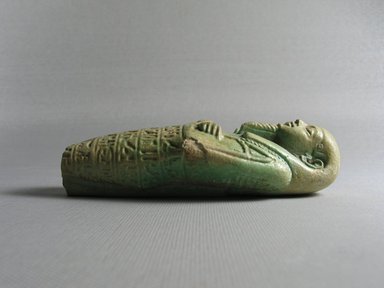  <em>Ushabti of the Chief Physician Psamtekseneb</em>, 664-525 B.C.E. Faience, 4 13/16 x 1 7/8 x 1 5/16 in. (12.3 x 4.8 x 3.3 cm). Brooklyn Museum, Charles Edwin Wilbour Fund, 37.204E. Creative Commons-BY (Photo: Brooklyn Museum, CUR.37.204E_view3.jpg)