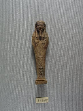  <em>Mummiform Ushabti of Wah-ib-re-em-akhet</em>, 664–525 B.C.E. Faience, 4 5/16 x 1 3/16 x 1 1/16 in. (11 x 3 x 2.8 cm). Brooklyn Museum, Charles Edwin Wilbour Fund, 37.215E. Creative Commons-BY (Photo: Brooklyn Museum, CUR.37.215E_view1.jpg)