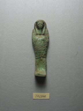  <em>Ushabti of Yuf-o</em>, 664-343 B.C.E. Faience, 3 9/16 x 1 1/16 x 11/16 in. (9 x 2.8 x 1.8 cm). Brooklyn Museum, Charles Edwin Wilbour Fund, 37.229E. Creative Commons-BY (Photo: Brooklyn Museum, CUR.37.229E_view1.jpg)