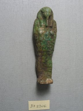  <em>Ushabti of Yuf-o</em>, 664-343 B.C.E. Faience, 3 9/16 x 1 1/16 x 11/16 in. (9 x 2.8 x 1.8 cm) . Brooklyn Museum, Charles Edwin Wilbour Fund, 37.230E. Creative Commons-BY (Photo: Brooklyn Museum, CUR.37.230E_view3.jpg)
