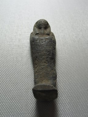  <em>Ushabti of Yuf-o</em>, 664-343 B.C.E. Faience, 3 1/4 x 1 x 13/16 in. (8.3 x 2.5 x 2 cm). Brooklyn Museum, Charles Edwin Wilbour Fund, 37.237E. Creative Commons-BY (Photo: Brooklyn Museum, CUR.37.237E_view12.jpg)