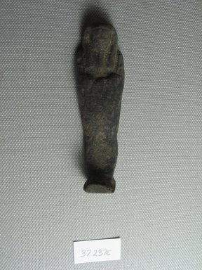  <em>Ushabti of Yuf-o</em>, 664-343 B.C.E. Faience, 3 1/4 x 1 x 13/16 in. (8.3 x 2.5 x 2 cm). Brooklyn Museum, Charles Edwin Wilbour Fund, 37.237E. Creative Commons-BY (Photo: Brooklyn Museum, CUR.37.237E_view3.jpg)