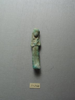  <em>Uninscribed Ushabti</em>, 664-332 B.C.E. Faience, 2 3/8 x 9/16 x 3/8 in. (6 x 1.5 x 1 cm). Brooklyn Museum, Charles Edwin Wilbour Fund, 37.242E. Creative Commons-BY (Photo: Brooklyn Museum, CUR.37.242E_view1.jpg)