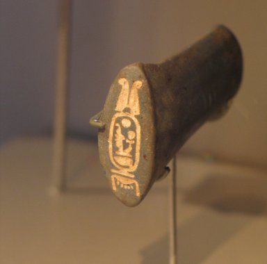  <em>Handle of Model Ax Inscribed for Amunhotep III</em>, ca. 1390–1352 B.C.E. Lapis lazuli, 1 15/16 x 1 3/8 in. (4.9 x 3.5 cm). Brooklyn Museum, Charles Edwin Wilbour Fund, 37.280E. Creative Commons-BY (Photo: Brooklyn Museum, CUR.37.280E_erg456.jpg)