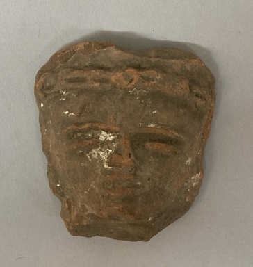 Huastec. <em>Head Fragment</em>, ca. 1250–1520. Reddish clay, 2 3/4 × 2 5/8 × 1 in. (7 × 6.7 × 2.5 cm). Brooklyn Museum, Frank Sherman Benson Fund and the Henry L. Batterman Fund, 37.2845PA. Creative Commons-BY (Photo: Brooklyn Museum, CUR.37.2845PA_overall.jpg)