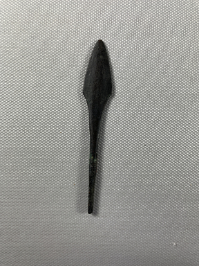  <em>Small Spear Tip</em>. Bronze, 3 7/16 × 9/16 × 3/16 in. (8.8 × 1.5 × 0.4 cm). Brooklyn Museum, Charles Edwin Wilbour Fund, 37.292E. Creative Commons-BY (Photo: Brooklyn Museum, CUR.37.292E_view01.jpg)