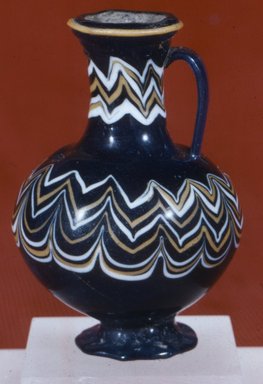  <em>Polychrome Core-formed Bottle with Festooned Design</em>, ca. 1390-1336 B.C.E. Glass, 3 3/8 x Diam. 2 7/16 in. (8.6 x 6.2 cm). Brooklyn Museum, Charles Edwin Wilbour Fund, 37.341E. Creative Commons-BY (Photo: Brooklyn Museum, CUR.37.341E_view5.jpg)