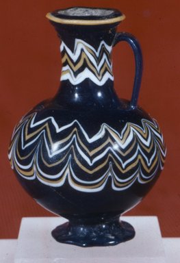  <em>Polychrome Core-formed Bottle with Festooned Design</em>, ca. 1390–1336 B.C.E. Glass, 3 3/8 x Diam. 2 7/16 in. (8.6 x 6.2 cm). Brooklyn Museum, Charles Edwin Wilbour Fund, 37.341E. Creative Commons-BY (Photo: Brooklyn Museum, CUR.37.341E_view5.jpg)