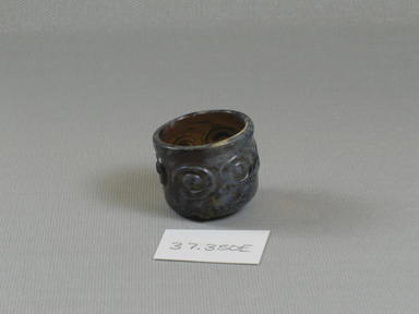 Islamic. <em>Small Cup</em>, 7th-11th century C.E. Glass, 1 x Diam. 1 5/16 in. (2.5 x 3.3 cm). Brooklyn Museum, Charles Edwin Wilbour Fund, 37.350E. Creative Commons-BY (Photo: Brooklyn Museum, CUR.37.350E_view1.jpg)
