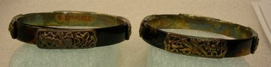  <em>Pair of Bracelets</em>, 19th century. Silver gilt, each: 3/16 x 1/2 x 3 1/8 in. (0.4 x 1.3 x 8 cm). Brooklyn Museum, Frank L. Babbott Fund, 37.371.129.1-.2. Creative Commons-BY (Photo: Brooklyn Museum, CUR.37.371.129.1-.2_view4.jpg)
