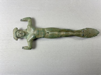 Greek. <em>Patera Handle</em>, early 5th century B.C.E. Bronze, 6 15/16 × 2 11/16 × 9/16 in. (17.6 × 6.8 × 1.5 cm). Brooklyn Museum, Museum Collection Fund, 37.376. Creative Commons-BY (Photo: Brooklyn Museum, CUR.37.376_view01.jpg)
