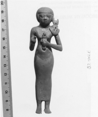  <em>Priestess of the Goddess Bastet</em>, ca. 664–332 B.C.E. Silver with mixture of copper, 4 3/4 x 1 7/16 x 1 5/16 in. (12.1 x 3.6 x 3.4 cm). Brooklyn Museum, Charles Edwin Wilbour Fund, 37.402E. Creative Commons-BY (Photo: , CUR.37.402E_NegC_print_bw.jpg)