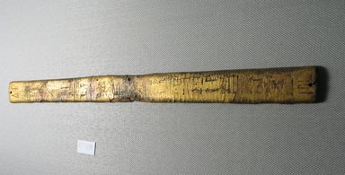  <em>Strip of Wood Covered with Gold Leaf Probably from a Piece of Furniture</em>, ca. 1539-1075 B.C.E. Wood, stucco, gold leaf, 13 1/16 x 15/16 x 1/8 in. (33.2 x 2.4 x 0.3 cm). Brooklyn Museum, Charles Edwin Wilbour Fund, 37.439E. Creative Commons-BY (Photo: Brooklyn Museum, CUR.37.439E_view2.jpg)