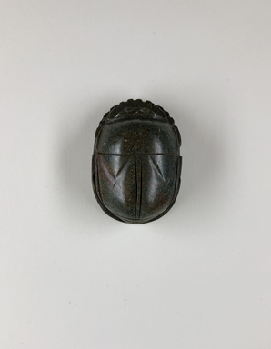  <em>Heart Scarab</em>, ca. 1539–1075 B.C.E. Stone (basalt?), 13/16 x 1 1/2 x 2 1/8 in. (2 x 3.8 x 5.4 cm). Brooklyn Museum, Charles Edwin Wilbour Fund, 37.488E. Creative Commons-BY (Photo: , CUR.37.488E_view01.jpg)