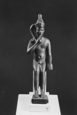  <em>Seated Statuette of the Child Horus Seated</em>, 305–30 B.C.E. Bronze, 5 11/16 x 1 3/4 x 3 5/16 in. (14.5 x 4.5 x 8.4 cm). Brooklyn Museum, Charles Edwin Wilbour Fund, 37.538E. Creative Commons-BY (Photo: Brooklyn Museum, CUR.37.538E_NegA_print_bw.jpg)