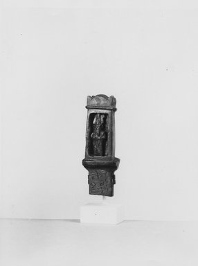  <em>Small Shrine with Figure of Osiris in Relief</em>, 664-525 B.C.E. Bronze, 2 15/16 x 1 x 3/4 in. (7.4 x 2.5 x 2 cm). Brooklyn Museum, Charles Edwin Wilbour Fund, 37.541E. Creative Commons-BY (Photo: Brooklyn Museum, CUR.37.541E_NegA_print_bw.jpg)