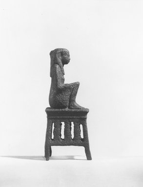  <em>Small Figure of the Goddess Maat Seated on s Stool</em>, 664-525 B.C.E. Bronze, 3 1/16 x 7/8 x 1 1/4 in. (7.8 x 2.2 x 3.2 cm). Brooklyn Museum, Charles Edwin Wilbour Fund, 37.542E. Creative Commons-BY (Photo: Brooklyn Museum, CUR.37.542E_NegA_print_bw.jpg)