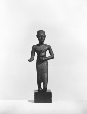  <em>Small Figure of a Priest Walking</em>, 664-332 B.C.E. Bronze, 3 1/16 x 1 7/16 x 13/16 in. (7.8 x 3.6 x 2.1 cm). Brooklyn Museum, Charles Edwin Wilbour Fund, 37.552E. Creative Commons-BY (Photo: Brooklyn Museum, CUR.37.552E_NegA_print_bw.jpg)