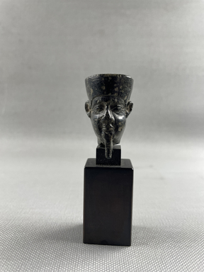  <em>Small Head from a Statuette Probably a Portrait of Amon - Re</em>, 664-332 B.C.E. Steatite, 1 9/16 × 1 × 1 1/16 in. (4 × 2.5 × 2.7 cm). Brooklyn Museum, Charles Edwin Wilbour Fund, 37.571E. Creative Commons-BY (Photo: Brooklyn Museum, CUR.37.571E_overall01.JPG)