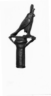  <em>Top of Ceremonial Staff in the Form of the Papyrus Column Surmounted by a Falcon</em>, 305-30 B.C.E. Bronze, 5 1/2 × 2 5/16 in. (14 × 5.8 cm). Brooklyn Museum, Charles Edwin Wilbour Fund, 37.575E. Creative Commons-BY (Photo: Brooklyn Museum, CUR.37.575E_NegID_37.574E_GRPA_cropped_bw.jpg)