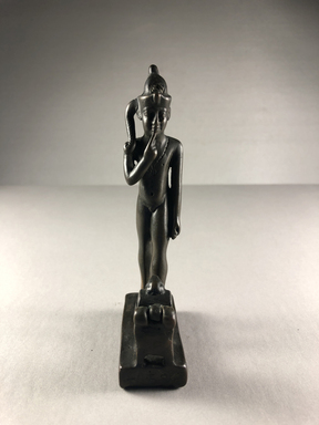  <em>Figure of the Child Horus Standing in Front of a Small Box with Moveable Cover</em>, 664-332 B.C.E. Bronze, 5 3/16 × 1 1/8 × 2 3/8 in. (13.1 × 2.8 × 6.1 cm). Brooklyn Museum, Charles Edwin Wilbour Fund, 37.593E. Creative Commons-BY (Photo: , CUR.37.593E_view01.jpg)