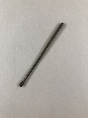  <em>Slender Instrument with Flat Rounded End, Possibly a Kohl Stick</em>. Copper alloy, 3/16 × diam. 3/16 × 4 3/4 in. (0.5 × 0.4 × 12.1 cm). Brooklyn Museum, Charles Edwin Wilbour Fund, 37.662E. Creative Commons-BY (Photo: , CUR.37.662E_view01.jpg)