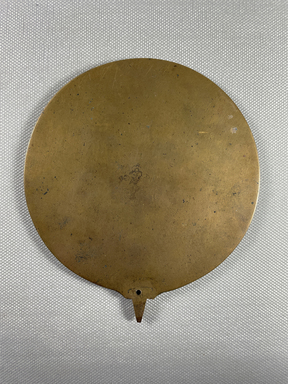  <em>Mirror without Handle</em>, 30 B.C.E.-395 C.E. Bronze, 4 7/16 × 7 5/8 in. (11.2 × 19.3 cm). Brooklyn Museum, Charles Edwin Wilbour Fund, 37.696E. Creative Commons-BY (Photo: Brooklyn Museum, CUR.37.696E_view01.jpg)